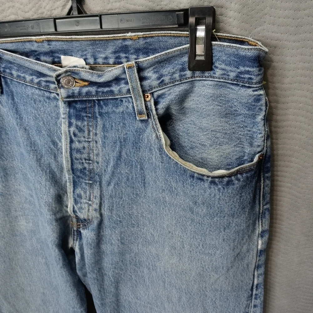 Levis 501XX men's button fly blue jeans. Sz 38x34.tear in seat. See last pic. M2